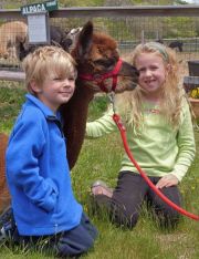 Some of friendliest of alpaca enthusiasts... Fin and Bailey Clark, enjoy meeting Hottie at our Alpaca Meet & Greet 